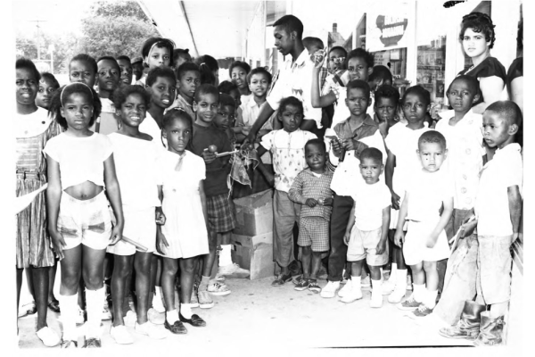 Children at Whelton Drug Store on Wooster Ave., eliminated to build the Innerbelt. (Mrs. Kirkland and students at Howe School on W. Bowery, eliminated to build the Innerbelt. (Photo courtesy of The University of Akron Archival Services)
