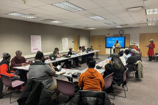 A group of community members gathered in discussion.