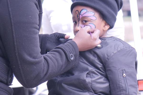 Child gets face painted like butterfly at Open Streets @ Innerbelt event, Sept. 10, 2022