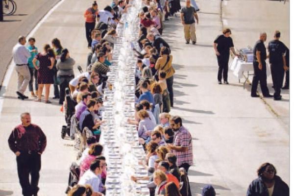 In 2015, artist Hunter Franks coordinated 500 plates, a meal on the Innerbelt to bring Akron residents together. (Photo courtesy of Akron Beacon Journal)