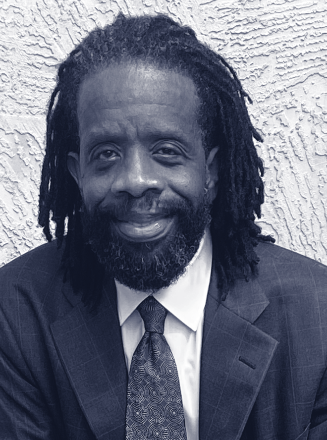 Black man in suit with blue tie